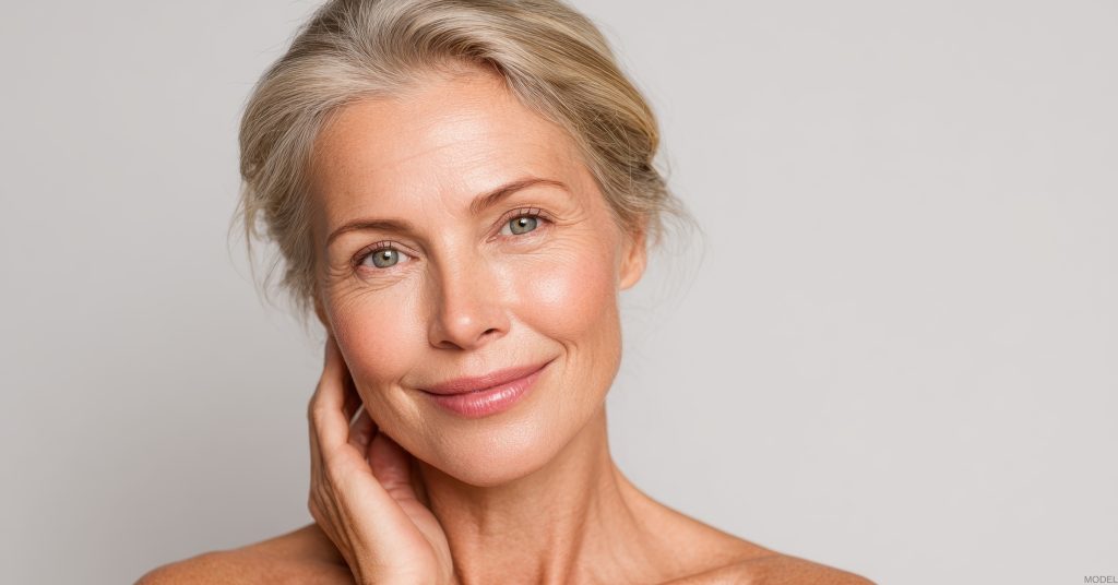 Woman smiling after a facelift (model)